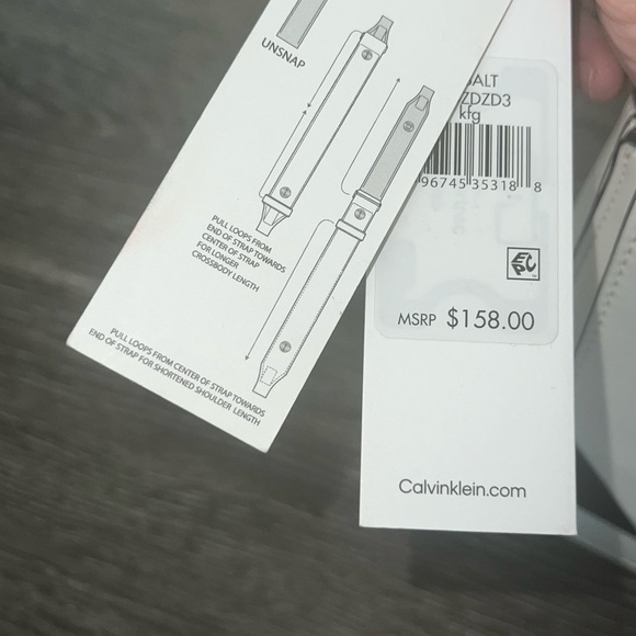 Never worn Calvin Klein purse, with adjustable strap, comes in a duffle bag. - Picture 3 of 6